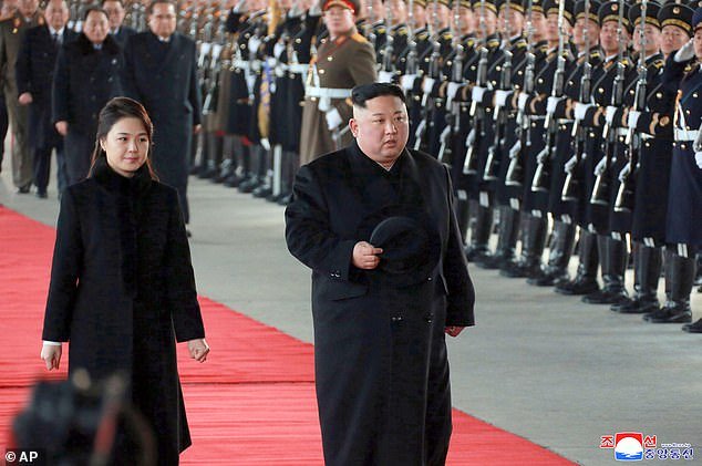27623156-8256791-North_Korean_leader_Kim_Jong_Un_walks_with_his_wife_Ri_Sol_Ju_at-a-14_1587835501208.jpg